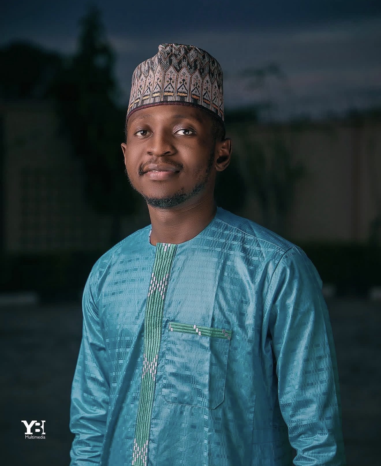 Portrait of Yahaya Buhari Ali in blue traditional Nigerian attire