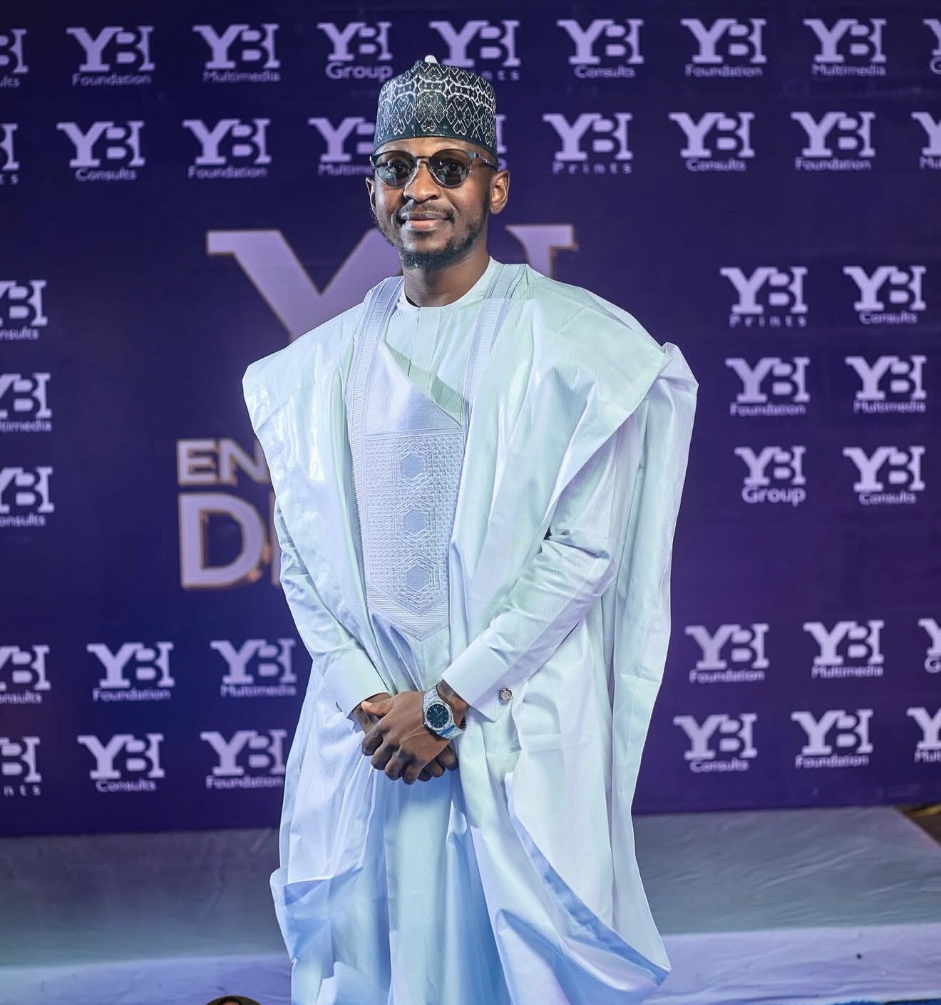 Yahaya Buhari Ali in white traditional Nigerian attire at a YBI event